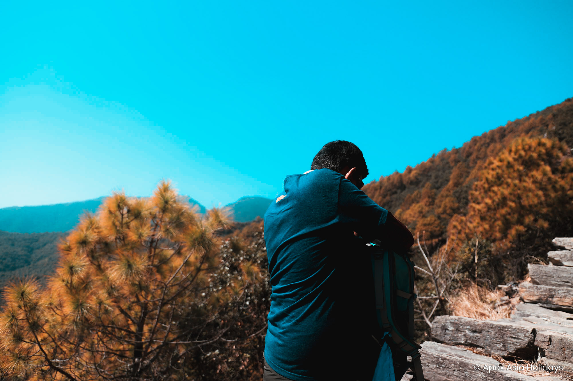 A hiker seeking choclates in the bag
